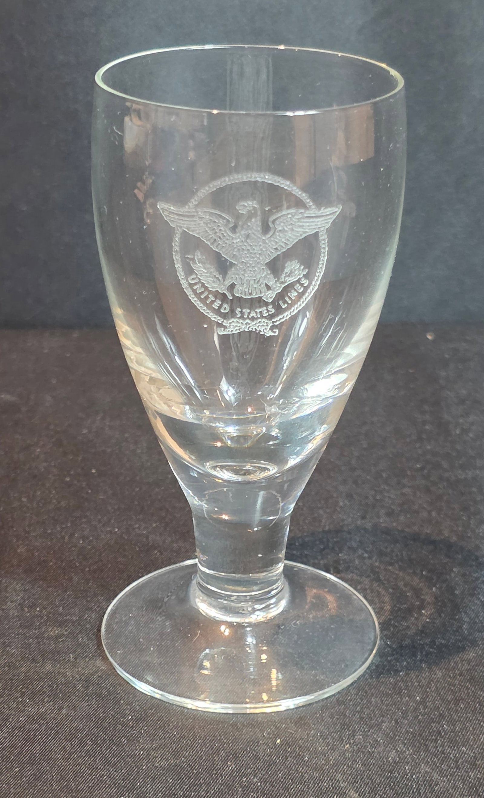 S.S. United States Whiskey Sour Glass: 5oz. Unmarked. Dates from the 1950-60s. 50% of all proceeds from the sale of this lot will be donated to the Raise Your Banner Foundation, a Washington DC based non-profit whose mission is to break do
