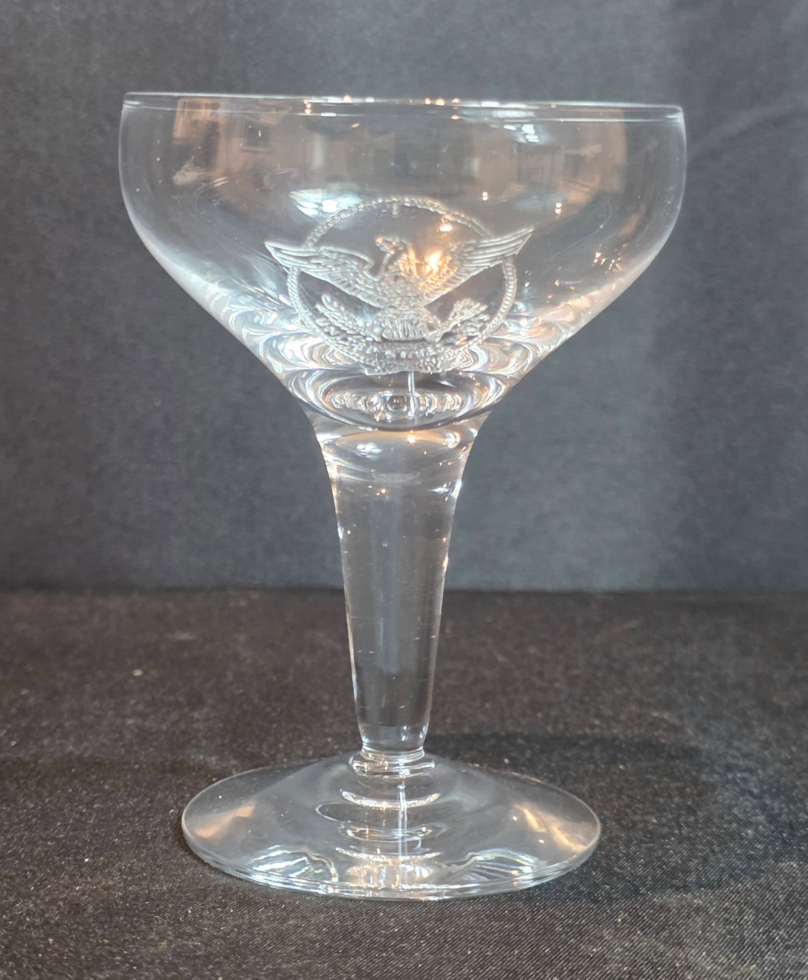 S.S. United States Champagne Glass: 6oz. Unmarked. Dates from the 1950-60s. 50% of all proceeds from the sale of this lot will be donated to the Raise Your Banner Foundation, a Washington DC based non-profit whose mission is to break do