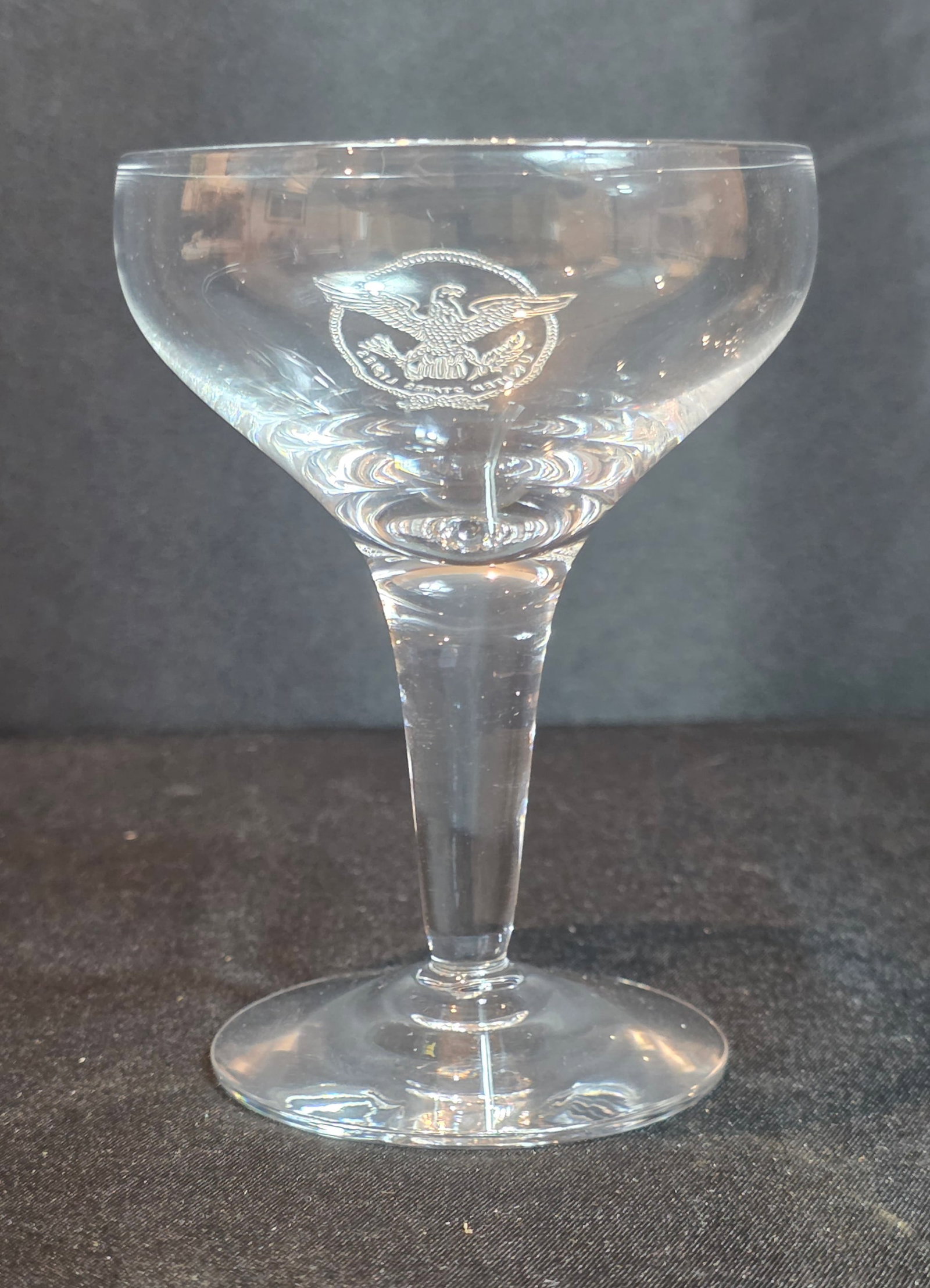 S.S. United States Champagne Glass: 6oz. Unmarked. Dates from the 1950-60s. 50% of all proceeds from the sale of this lot will be donated to the Raise Your Banner Foundation, a Washington DC based non-profit whose mission is to break do