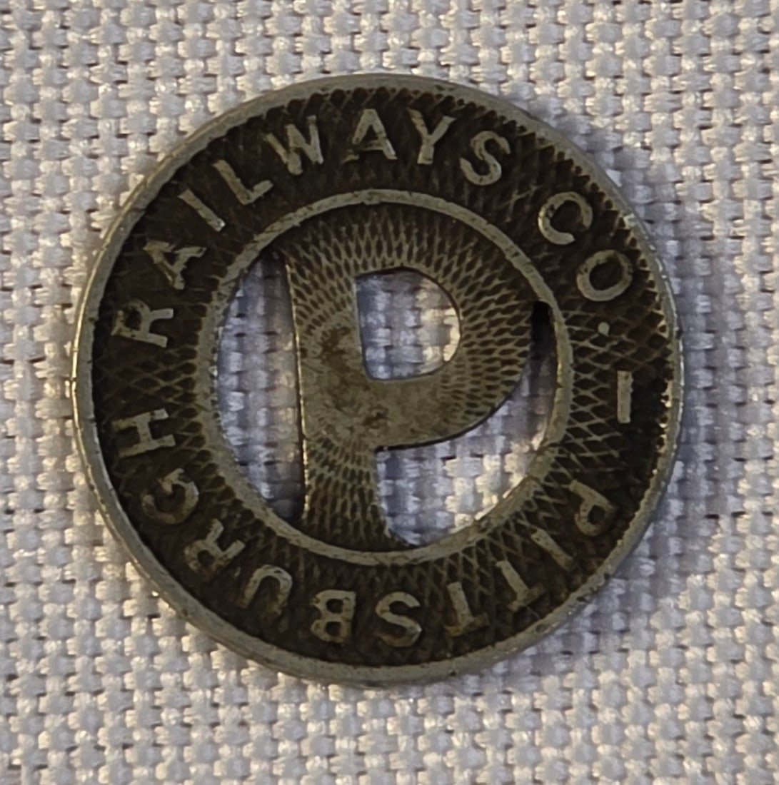 Pittsburgh Railway Token: 16mm, 1920s. 50% of all proceeds from the sale of this lot will be donated to the Raise Your Banner Foundation, a Washington DC based non-profit whose mission is to break down the stigma surrounding m