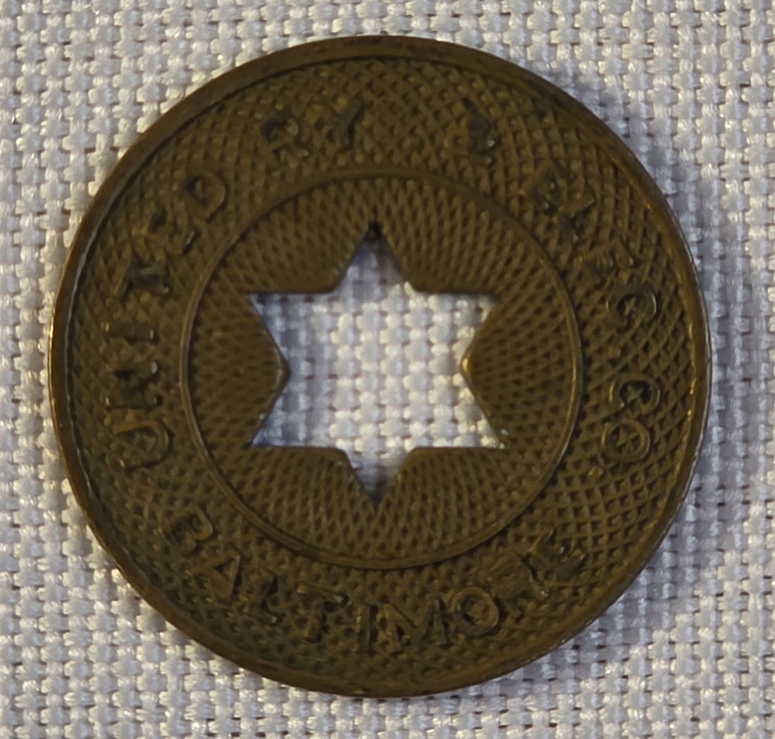 Baltimore United Railway & Electric Company Token: 21mm. 50% of all proceeds from the sale of this lot will be donated to the Raise Your Banner Foundation, a Washington DC based non-profit whose mission is to break down the stigma surrounding mental h