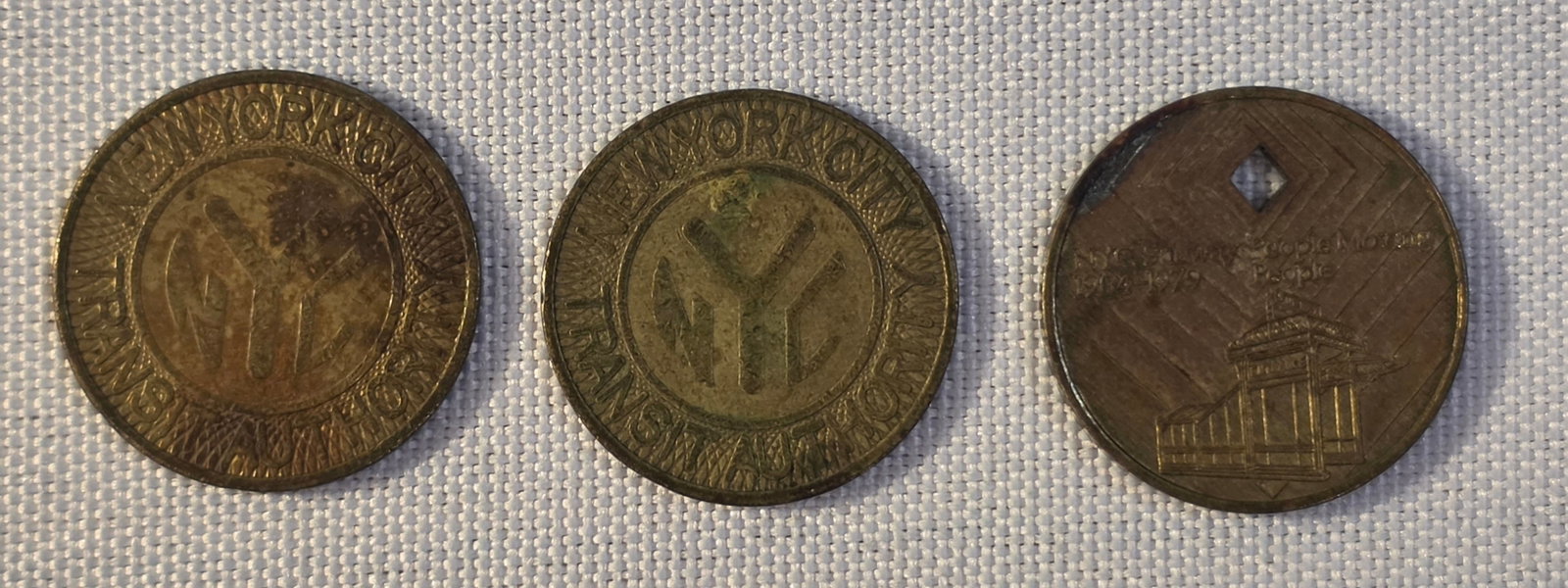 New York City Transit Token Lot: 2x 22mm uncut,1975-86 and one Diamond Jubillee, 1979-80. 50% of all proceeds from the sale of this lot will be donated to the Raise Your Banner Foundation, a Washington DC based non-profit whose