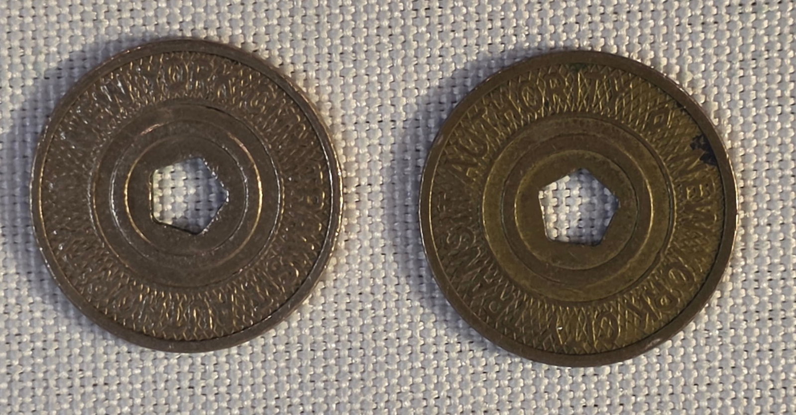New York City Transit Token Lot: 2x 20mm, 1995-03. 50% of all proceeds from the sale of this lot will be donated to the Raise Your Banner Foundation, a Washington DC based non-profit whose mission is to break down the stigma