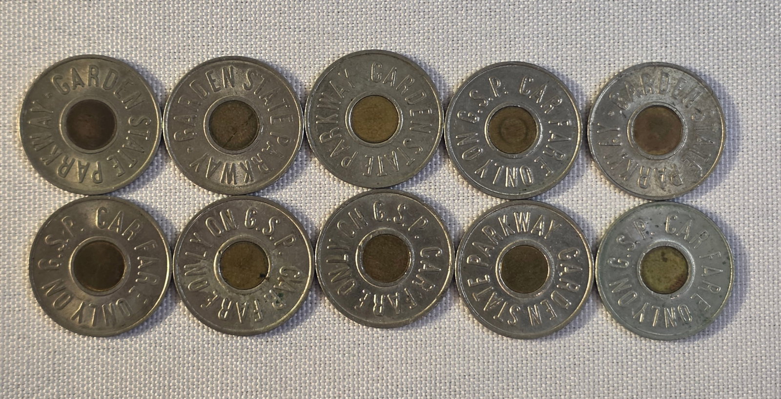 Garden State Parkway Token Lot: 10x 23mm, 1988. 50% of all proceeds from the sale of this lot will be donated to the Raise Your Banner Foundation, a Washington DC based non-profit whose mission is to break down the stigma