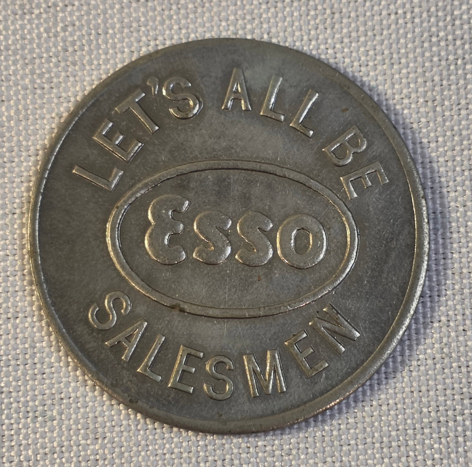 ESSO Salesman Coin: 38mm, 1950s.50% of all proceeds from the sale of this lot will be donated to the Raise Your Banner Foundation, a Washington DC based non-profit whose mission is to break down the stigma surrounding