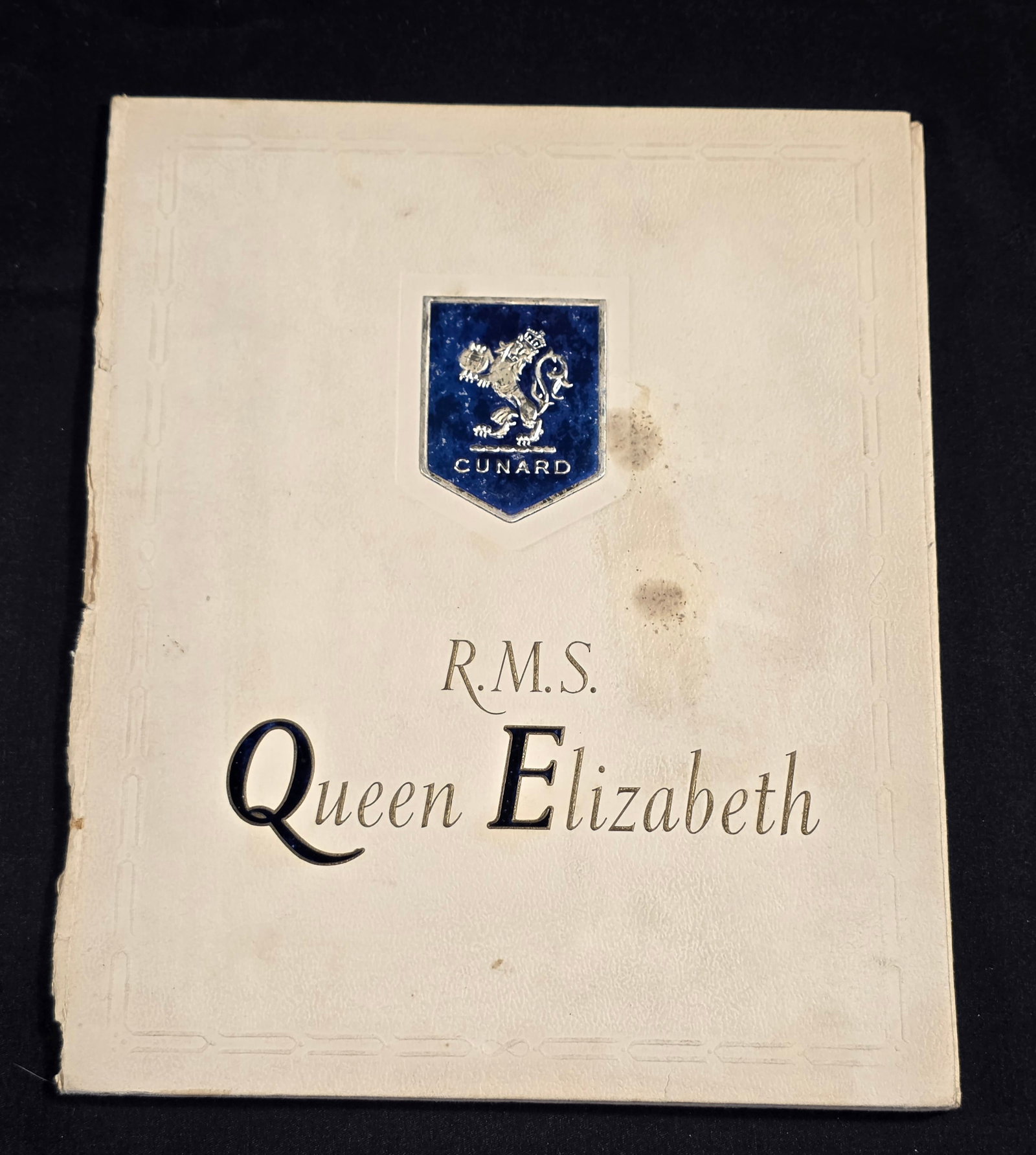 R.M.S Queen Elizabeth My Voyage Book: Hardbound, blank inside. Dates from the 1930s+. 50% of all proceeds from the sale of this lot will be donated to the Raise Your Banner Foundation, a Washington DC based non-profit whose mission is to