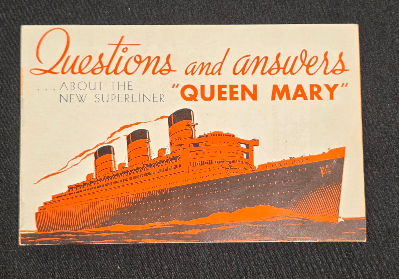 R.M.S. Queen Mary Questions & Answers Guide: Pocket guide from 1936. 50% of all proceeds from the sale of this lot will be donated to the Raise Your Banner Foundation, a Washington DC based non-profit whose mission is to break down the stigma