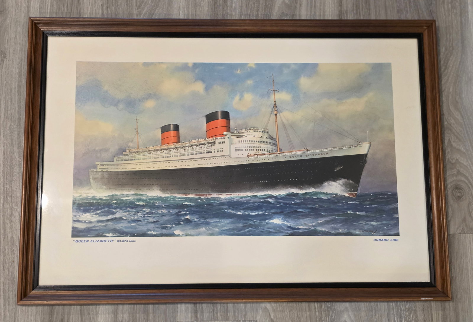 Cunard R.M.S. Queen Elizabeth Framed Print: Color by C.E. Turner. Measures 33" x 22". Undated. 50% of all proceeds from the sale of this lot will be donated to the Raise Your Banner Foundation, a Washington DC based non-profit whose mission is 