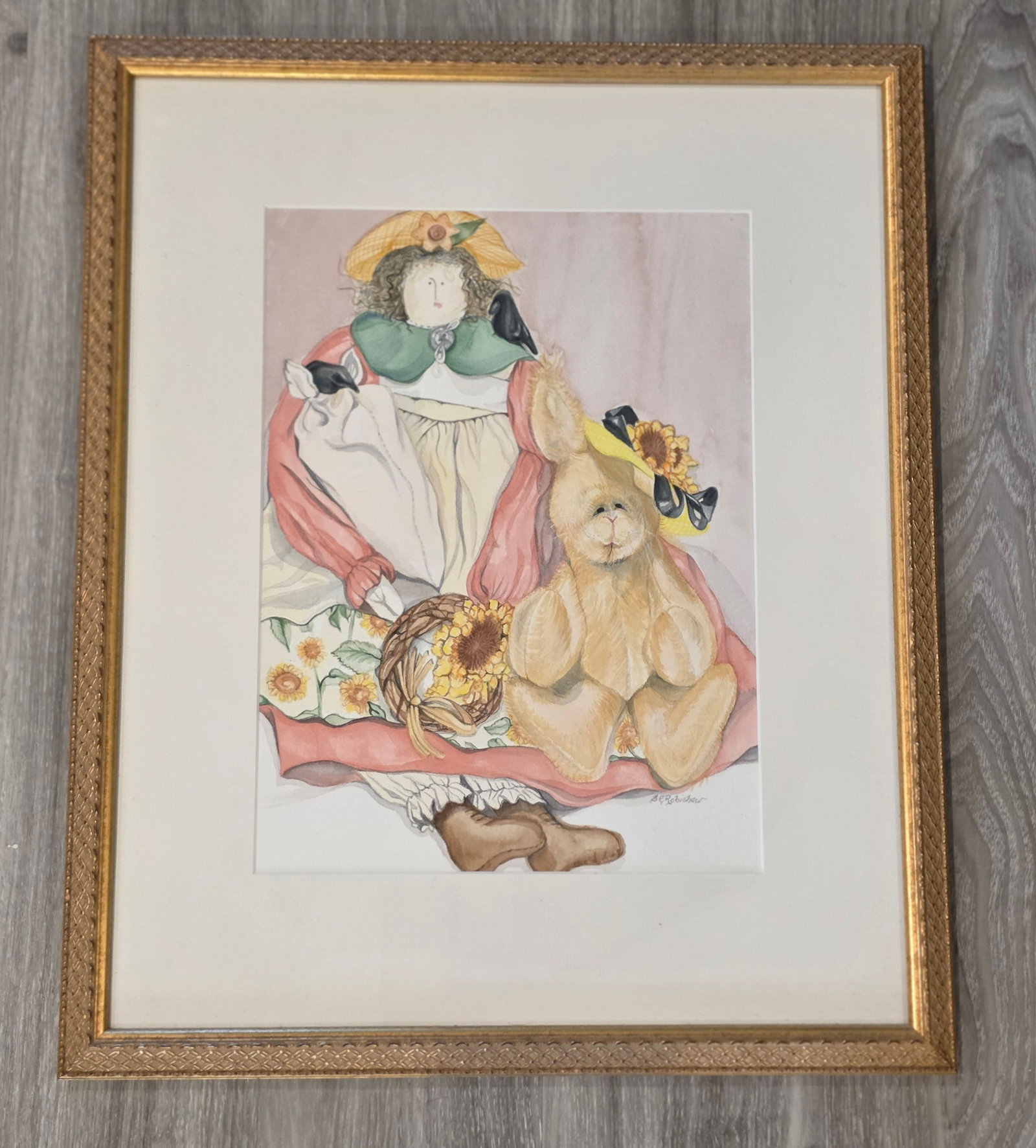Doll & Rabbit Still Life: Watercolor by Susan Robishaw, Massachusetts 1997. Gold frame, matted, 19" x 23". 100% of all proceeds from the sale of this lot will be donated to the Raise Your Banner Foundation, a Washington DC