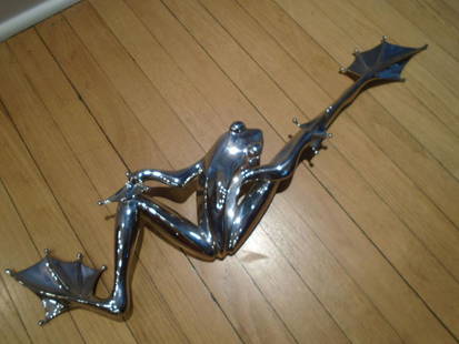 Vanquish Stainless Steel Frog by Tim Cotterill.: Stainless Steel Frog by Tim Cotterill. 24"long x 7 1/2"w. Stamped on the bottom "Frogman", Hand etched signature by the artist. Limited Edition 14/200.