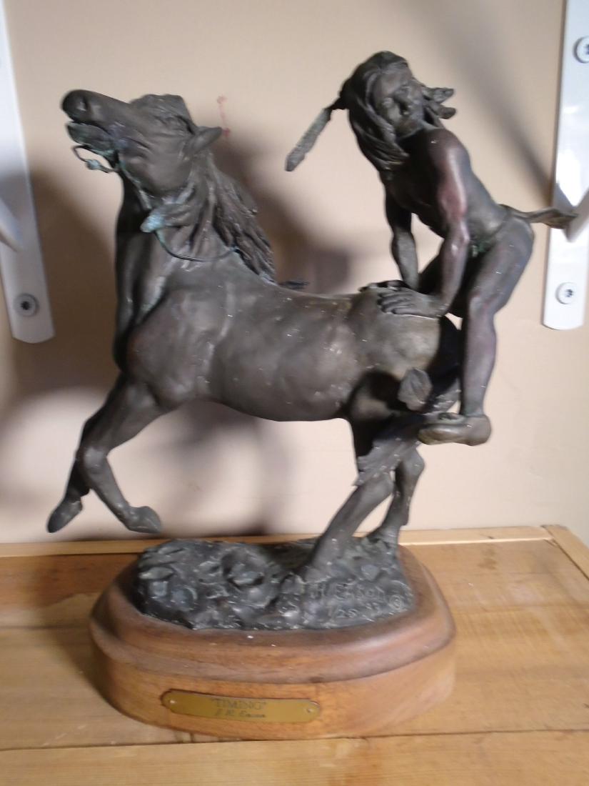 Timing Indian boy jumping onto the back of a horse (1 of 7)