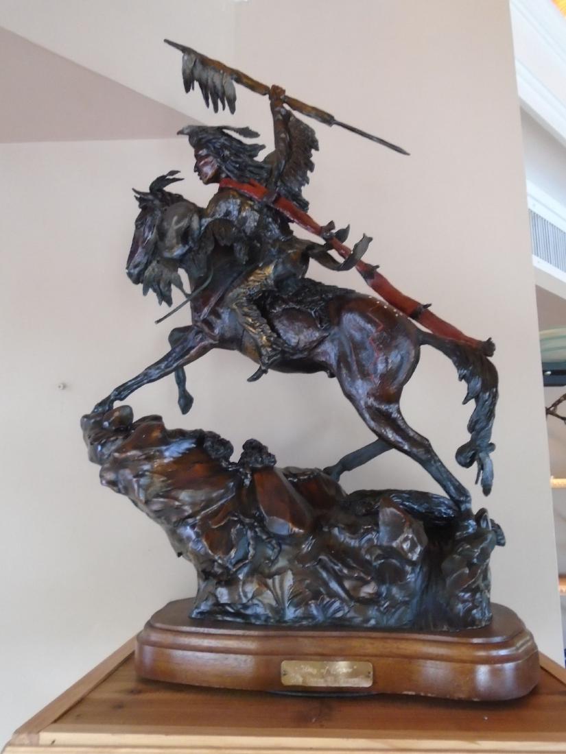 Day of Honor Indian riding a horse holding up a spear: Medium: Bronze Sculpture Size: 26â€ H X 19â€ L Title: Day of Honor Subject: Indian riding a horse toward the Viewerâ€™s left, holding up a spear, on a rotating base. Edition: Not apparent S