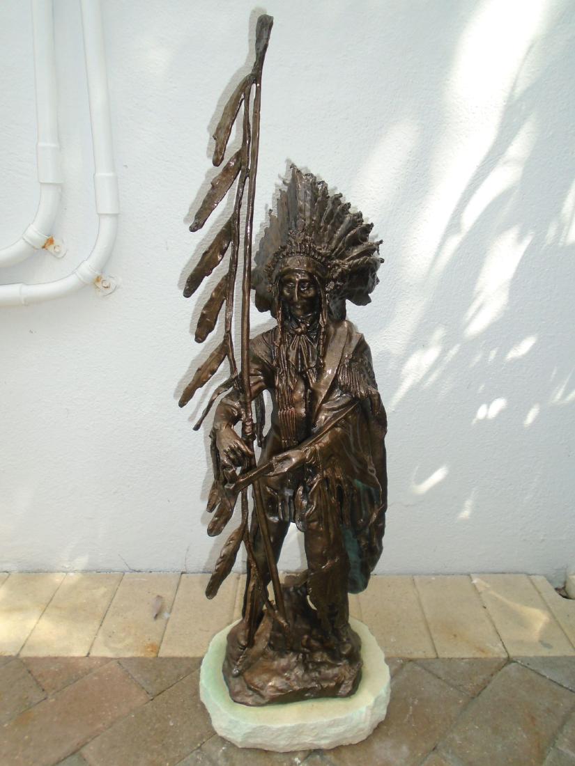 Indian chief standing holding a peace pipe & feathered (1 of 8)