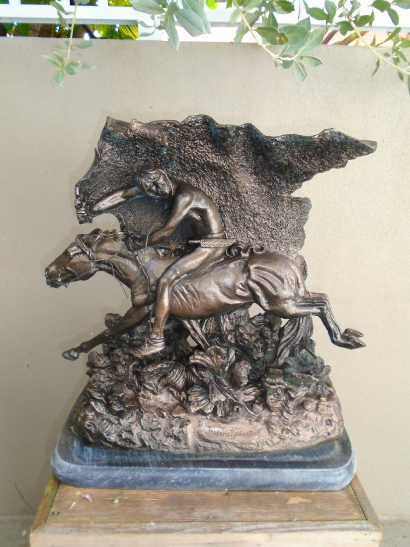 Indian holding a blanket while riding a running horse,: Medium: Bronze Sculpture, painted Size: 20 1/2â€h x 20"w x 10"d. Title: Unknown Subject: Indian holding a blanket while riding a running horse. Signature: Base. Frederic Remington.