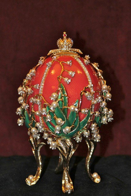 Faberge Imperial Lilies Of The Valley Egg: Faberge Imperial Lillies of the Valley Egg. Enamel guilloche and crystals. Top of the egg pops up to reveal 3 mini picture frames. 6.5" shut 8" open. Original padded box. Never displayed.
