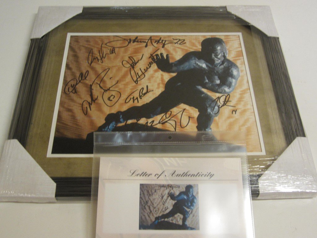 Heisman Trophy Signed Display: Heisman Trophy multisigned 11x14 photo professionally custom framed and matted. Over all measurements are 19.5"x16.5". There are nine total signatures: Johnny Rodgers, Gary Beban, Desmond Howard, Mike