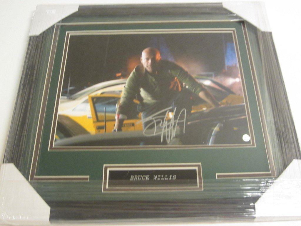 Bruce Willis Signed Display: Bruce Willis action movie star signed 11x14 color photo professionally custom framed and matted. Overall measurements are 19" x 20". This comes with a certificate of authenticity (COA).