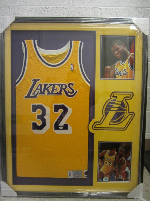 Magic Johnson Signed Jersey: Magic Johnson Los Angeles Lakers signe framed jersey professionally custom framed and matted. Overall measurements for this item are 34" x 42". This comes with a certificate of authenticity (COA).