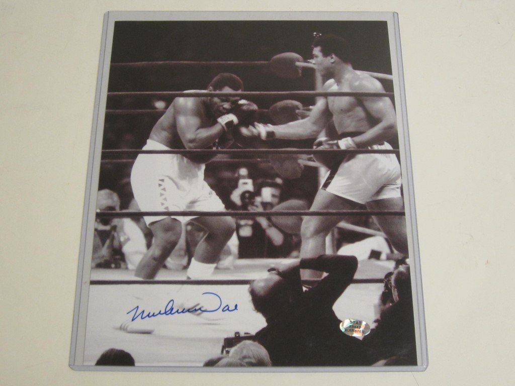 Muhammad Ali Signed 8x10 Photo: Muhammad Ali signed 8x10 black and white photo. This comes with a certificate of authenticity (COA)