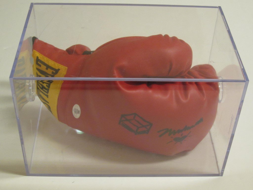 Muhammad Ali Signed Glove: Muhammad Ali boxing legend signed / autographed boxing glove. Ali also put a couple of doodles on this awesome item. This comes with a case and a certificate of authenticity (COA)