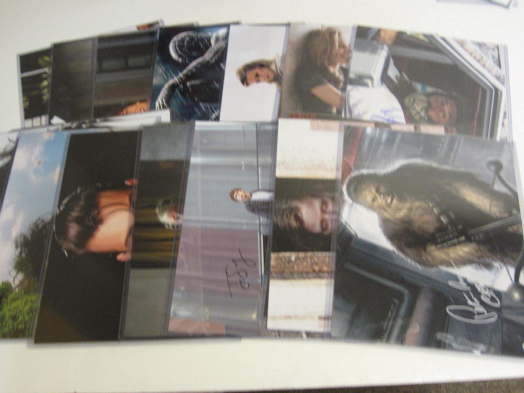 18 Signed Entertainment Photos: Huge Lot of 18 Entertainment signed / autographed 11x14 color photos with certificates of authenticity. Included in this lot are the following: Michael Bubel, (4) Johnny Depp, (2)Jesse Eisenberg, Toph