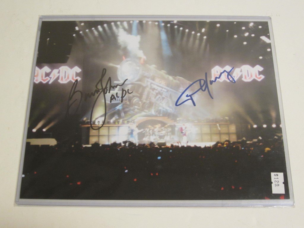 Angus Young/Johnson Signed Pic: Angus Young and Brian Johnson dual signed / autographed color 8x10 photo, this comes with a certificate of authenticity