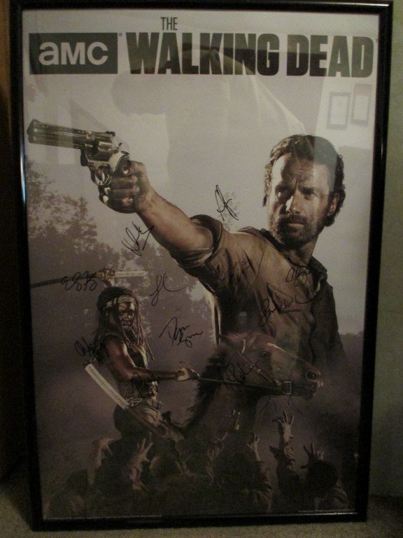 The Walking Dead signed poster: The Walking Dead signed 24 x 36 poster with frame. Over all measurements with frame are 25x37. This is signed by 11 of the cast members of this smash hit television show. This comes with a Certificate