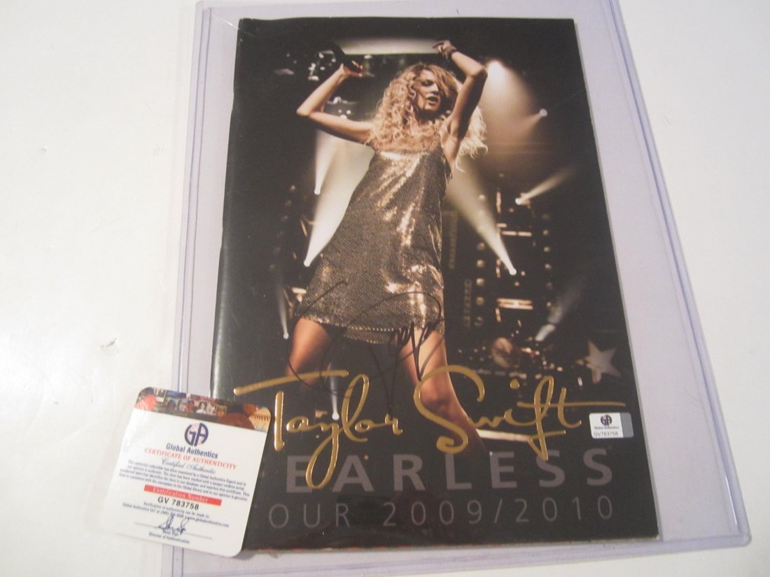 Taylor Swift signed program: This is a signed / autographed 2009-2010 Taylor Swift Fearless Tour book / program . This has been signed by Taylor Swift. This has been certified and authenticated by Global Authentics LLC (GA) #GV78