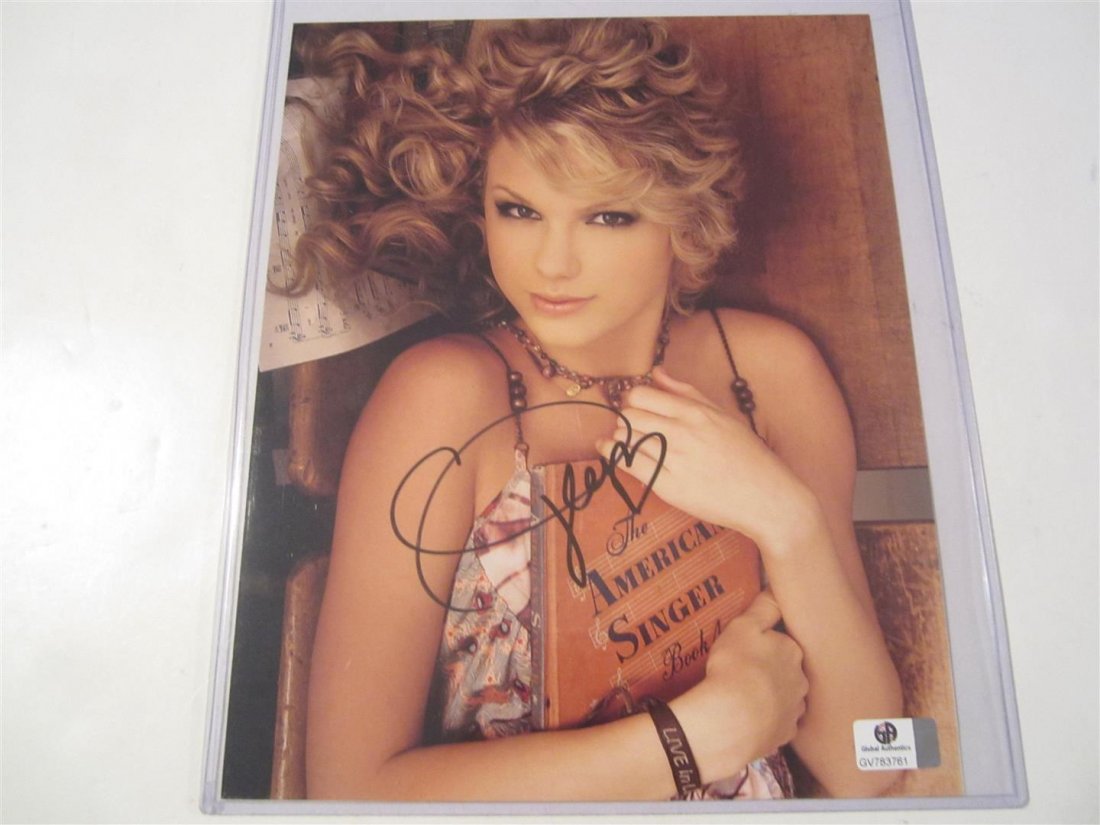 Taylor Swift signed photo: This is a signed / autographed 8x10 color. It has been signed by superstar singer songwriter Taylor Swift. It has been certified and authenticated by Global Authentics LLC (GA) #GV783761. https://www.