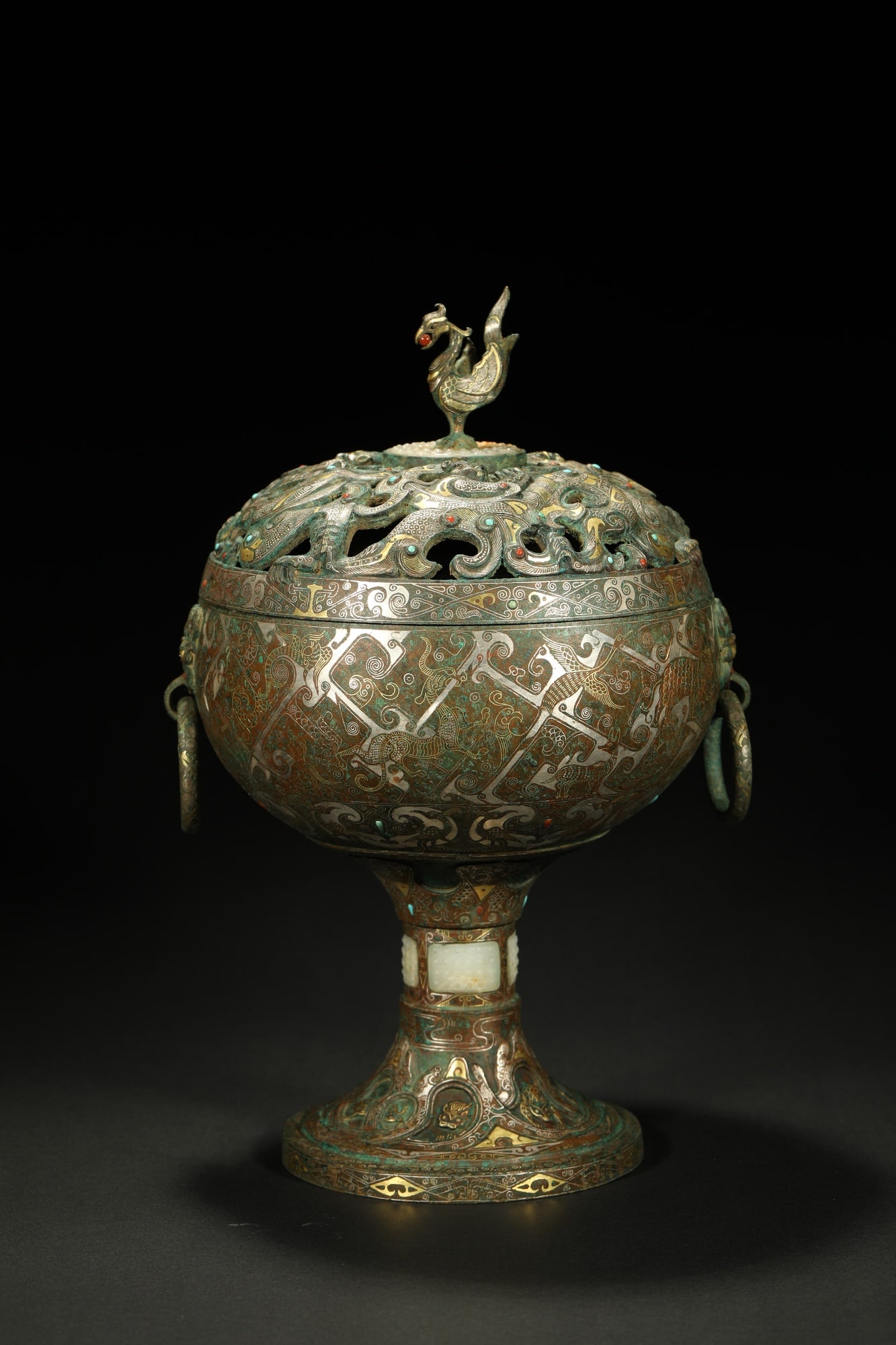 BRONZE GILT-SILVER INCENSE BURNER: Dimensions: 11 3/4 x 7 1/8 in; weight 3292 g This bronze gilt-silver incense burner presents a commanding ceremonial character through its rounded body and richly ornamented decorative surface. The el