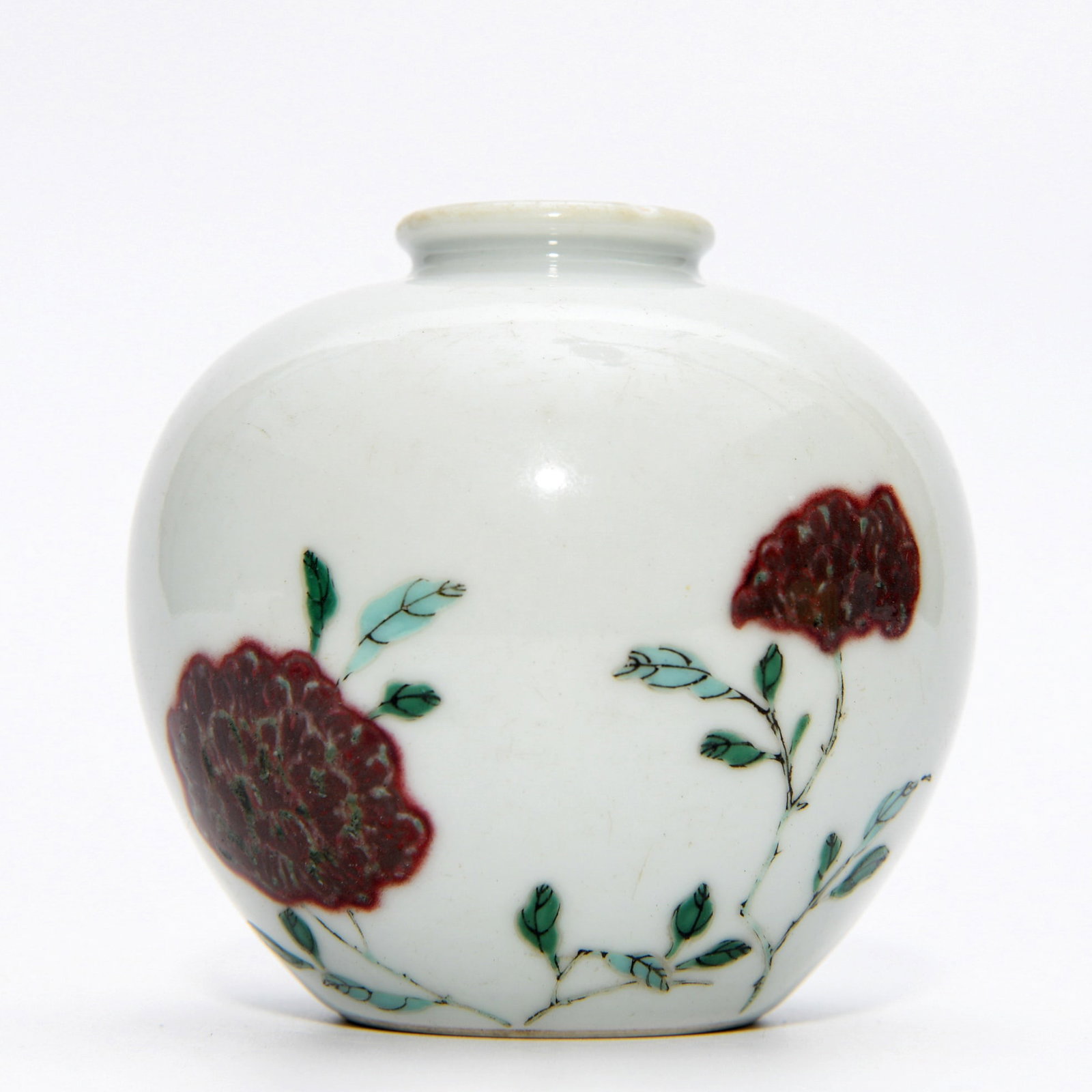 KANGXI IRON-RED GLAZED MEIPING: Dimensions: 3 1/4 x 3 3/8 in This Kangxi iron-red glazed meiping vase presents a refined and understated elegance through its harmonious form and restrained decorative approach. The softly rounded