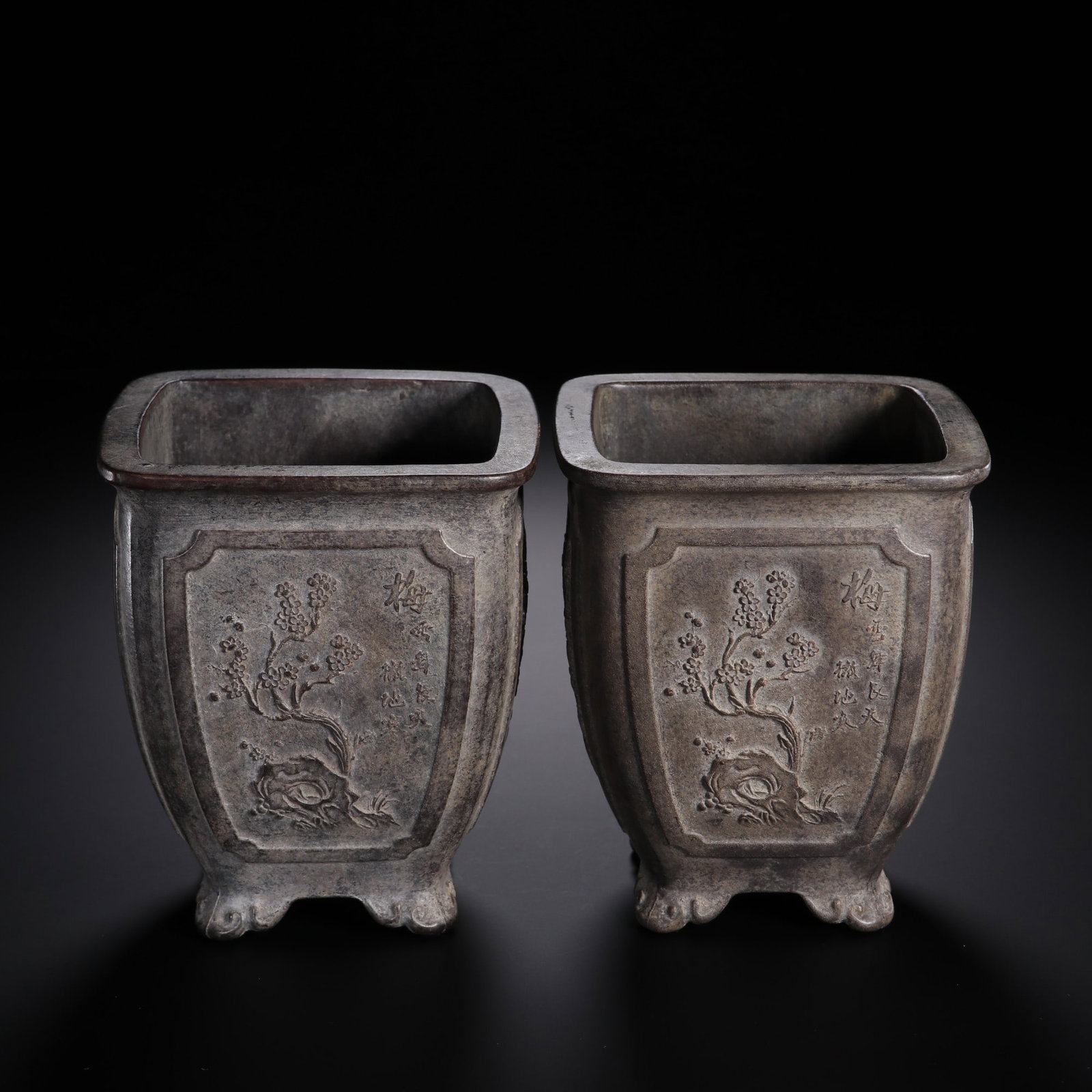 ZISHA BAMBOO AND CHRYSANTHEMUM PLANTER PAIR: Dimensions: 4 3/8 x 3 1/2 in; weight 1005 g This pair of zisha bamboo and chrysanthemum planters presents a harmonious blend of naturalistic carving and refined scholar's taste. The square bodies are