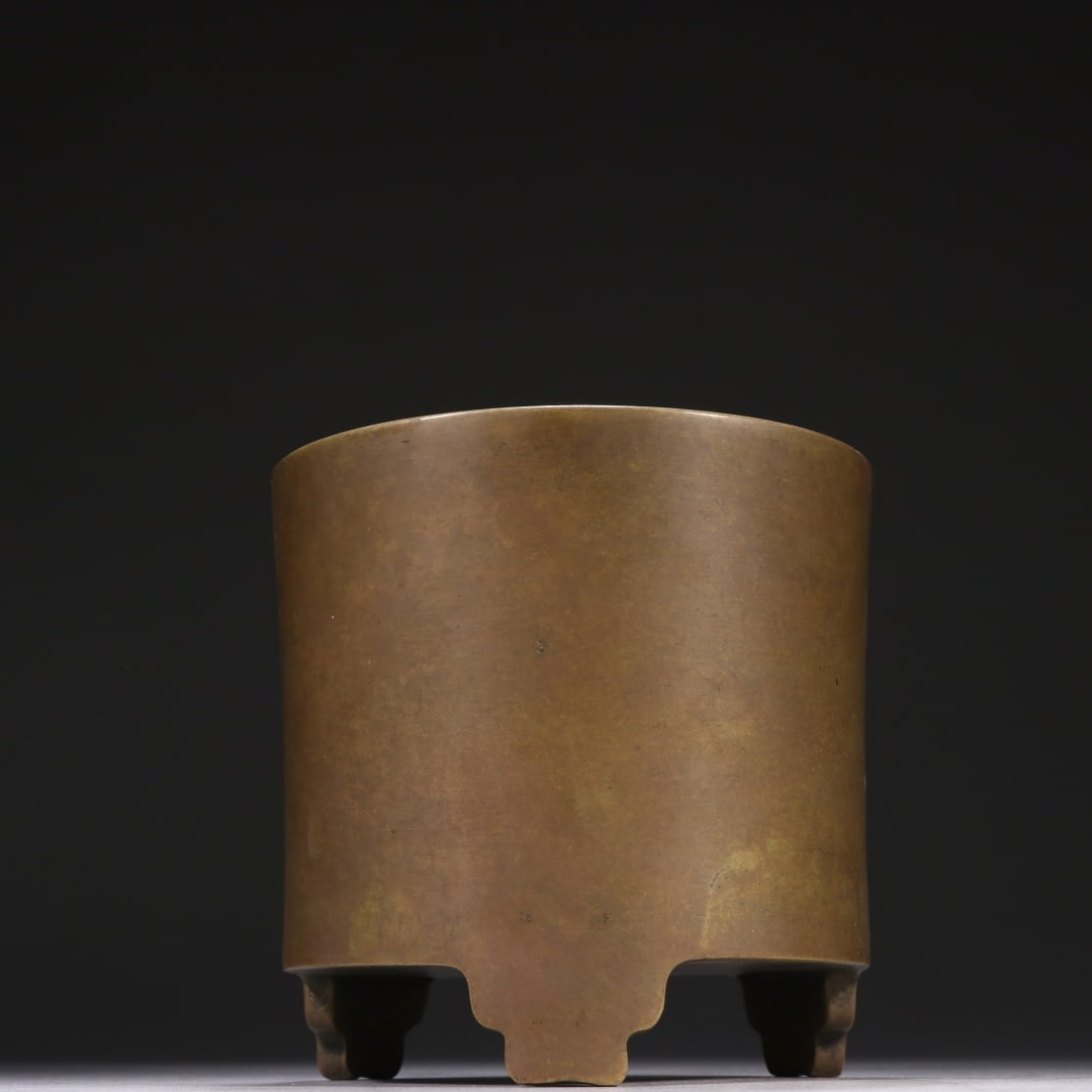 BRONZE TRIPOD CENSER: Dimensions: 4 5/8 x 4 3/4 in; weight 1550.3 g This bronze tripod censer presents a powerful and understated sculptural presence through its archaic-inspired form and restrained surface treatment. The