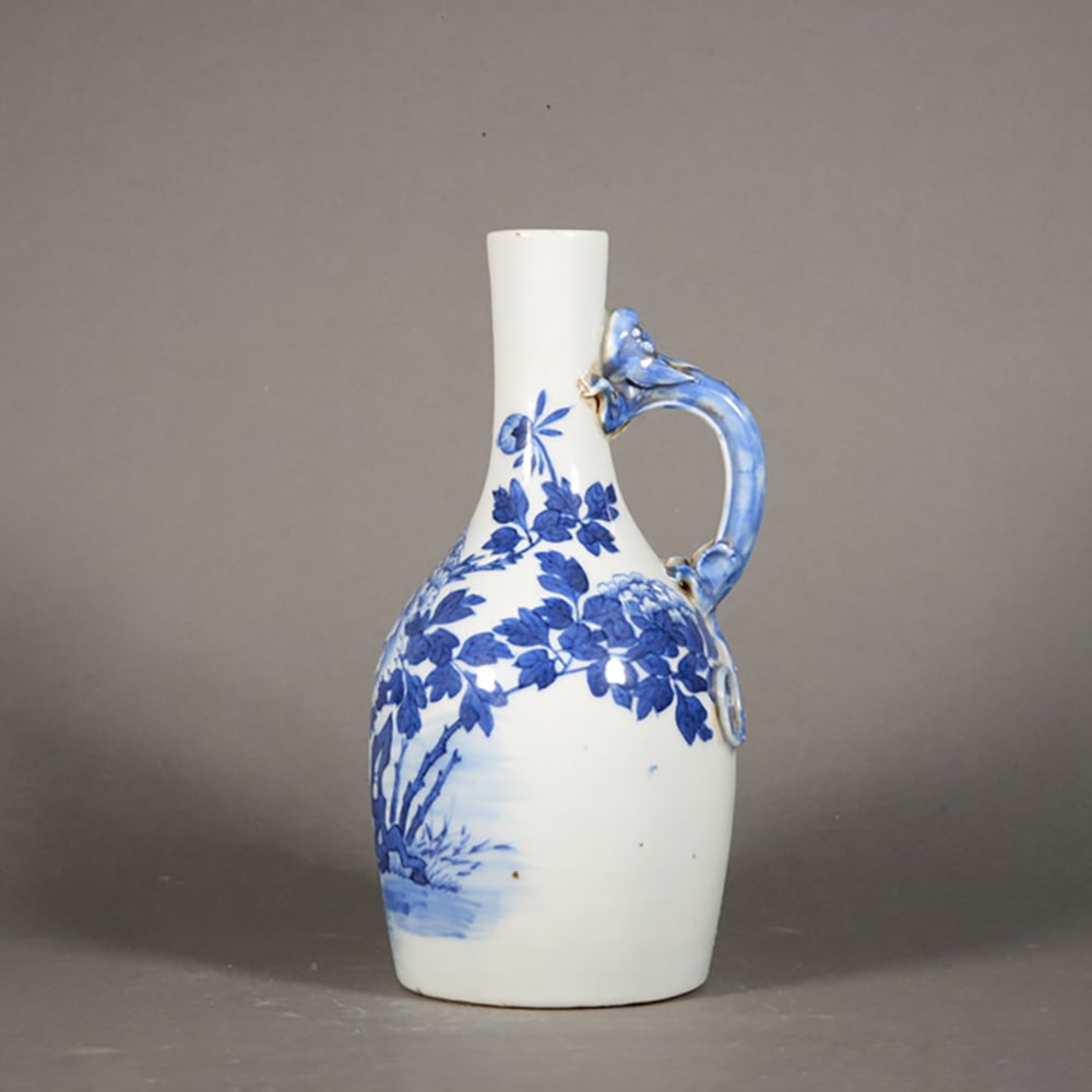 Blue and White Cave Stone Flower Pattern Dragon Handle Pot: Name Blue and White Cave Stone Flower Pattern Dragon Handle Pot Dimensions 22cm*12cm Condition Additional photographs and condition reports are available upon request as a courtesy to our clients.