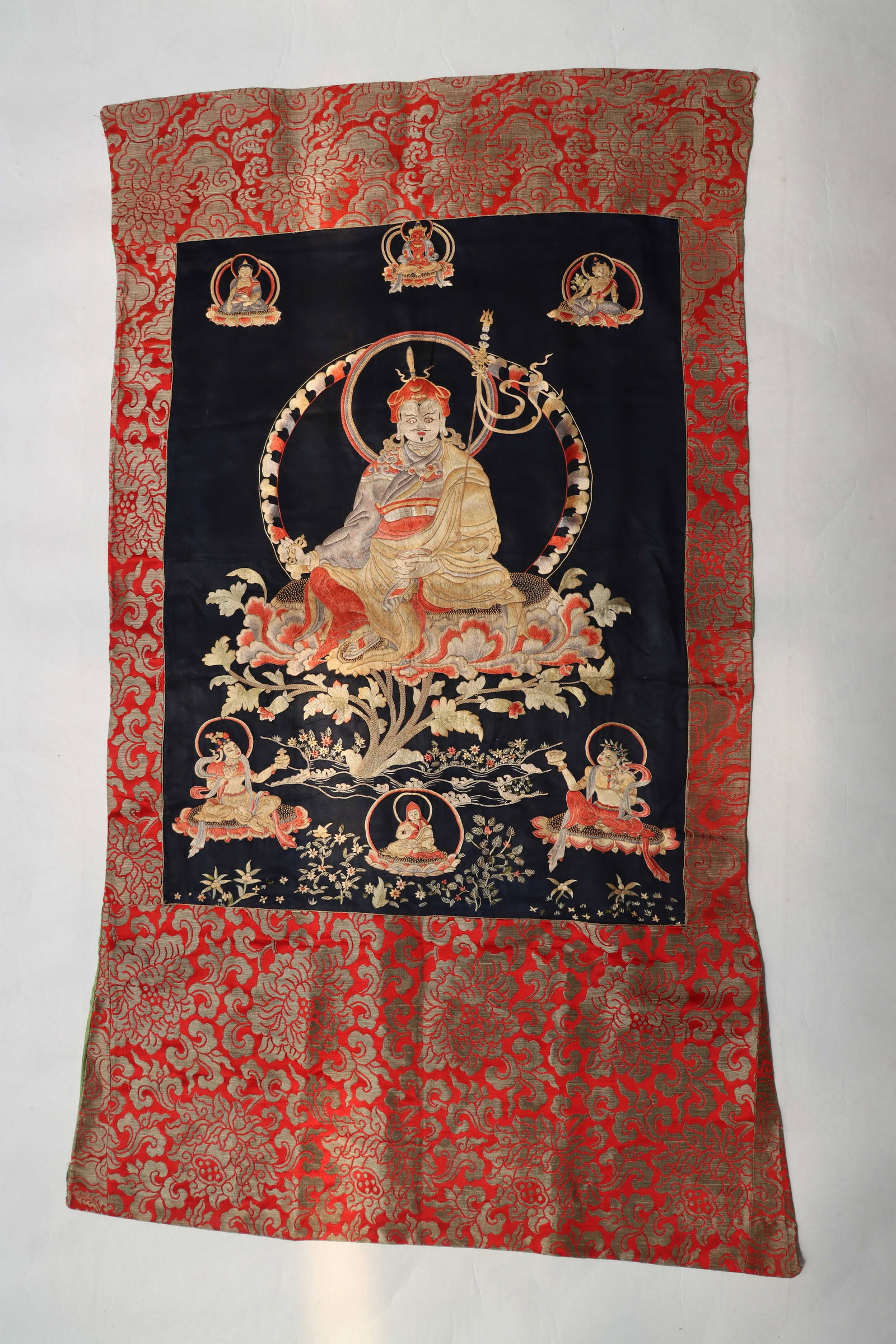 Embroidered Thangka: Name Embroidered Thangka Dimensions H 124CM D 80CM Condition Additional photographs and condition reports are available upon request as a courtesy to our clients. Any condition report represents an
