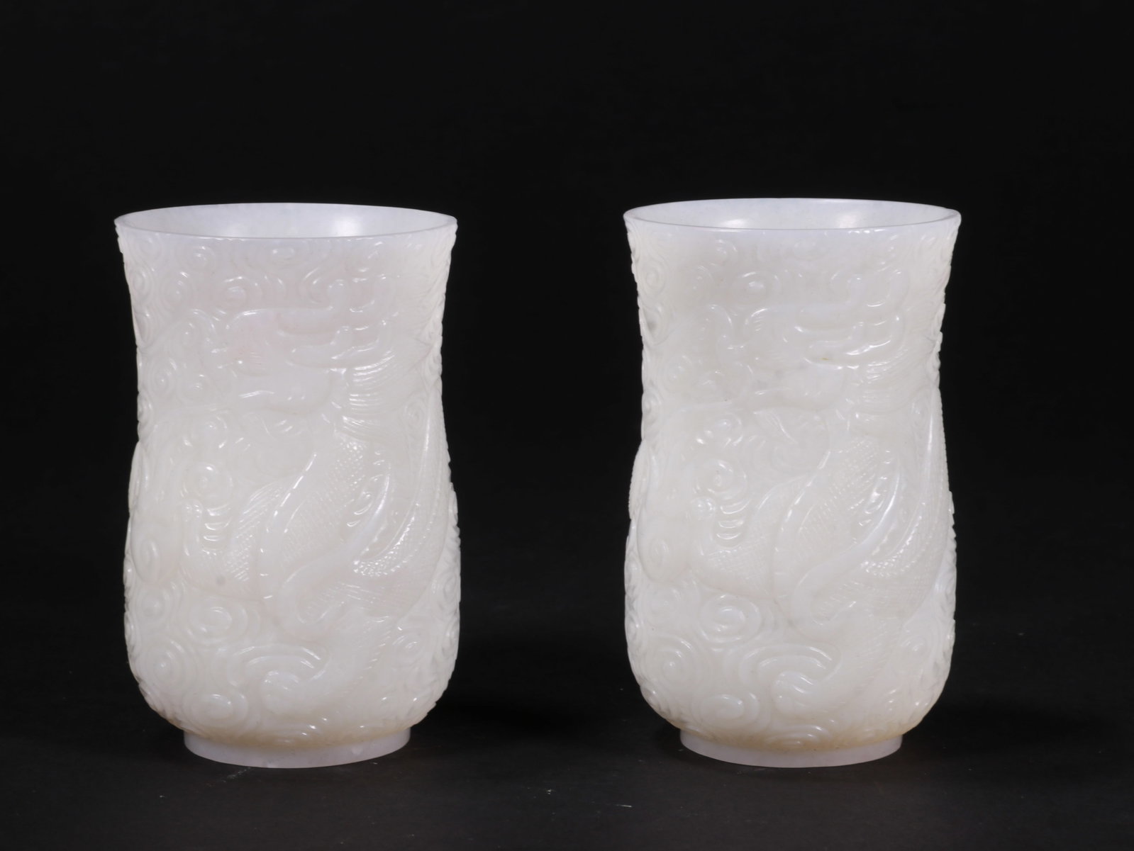A pair of white jade cups: Name A pair of white jade cups Dimensions 8.3CM*5.5CM Condition Additional photographs and condition reports are available upon request as a courtesy to our clients. Any condition report represents