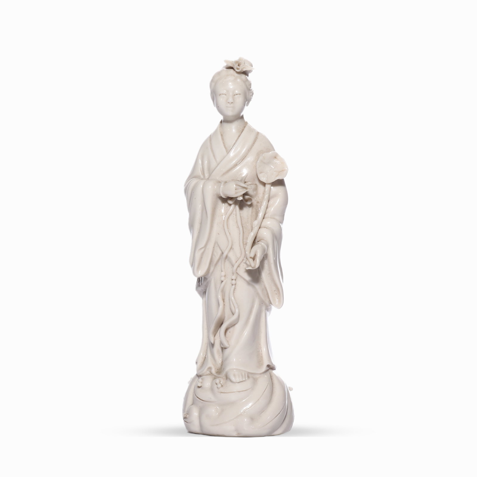 A WHITE GLAZED GUANYIN STATUE FROM THE DEHUA KILN OF THE QING DYNASTY (1 of 4)