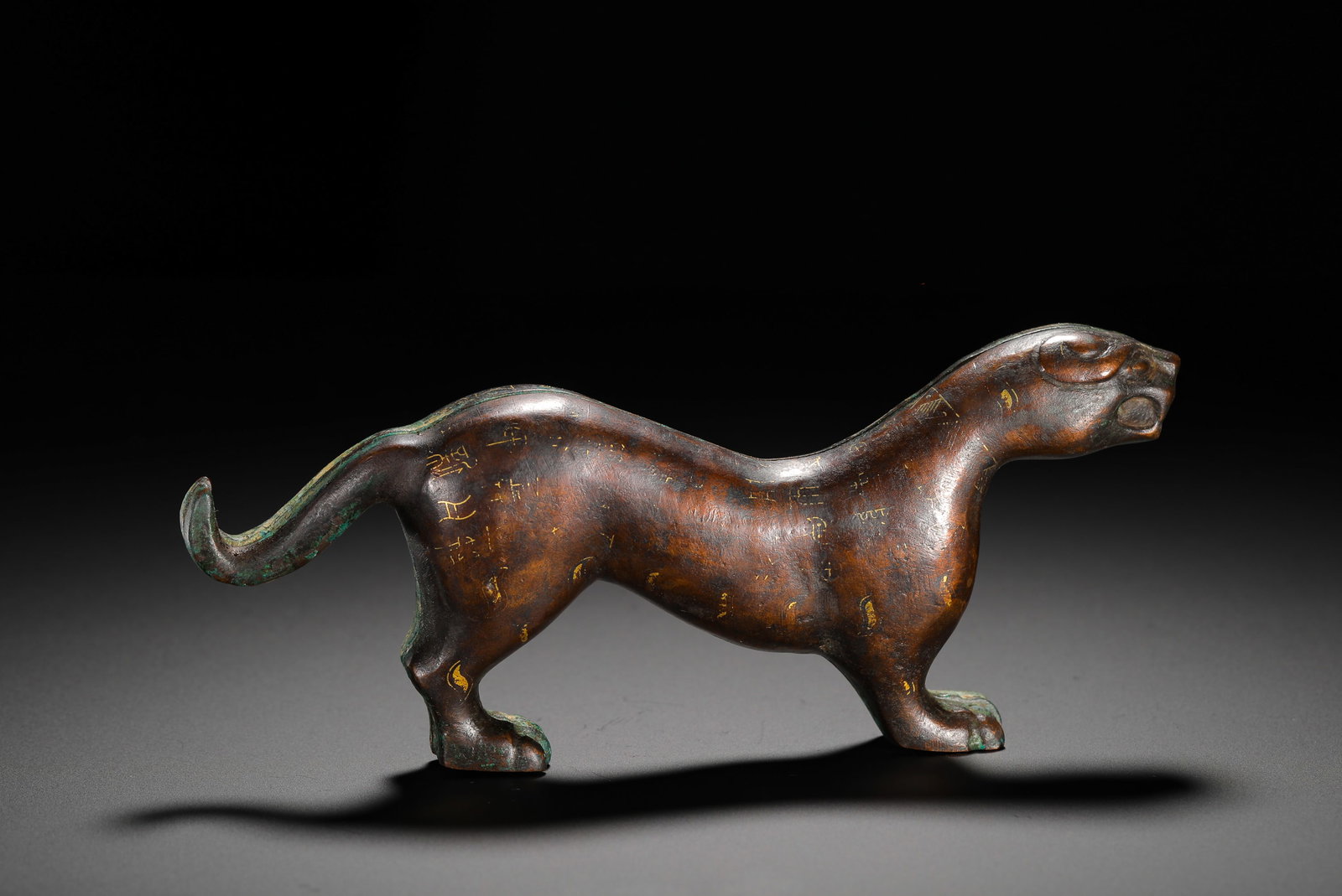 BRONZE FROM THE WARRING STATES PERIOD WITH GOLD INSCRIPTIONS ON THE TIGER TALISMAN: Height:8cm(3.15in) Width:17cm(6.69in) Weight:950g(2.09lb)A pair of Warring States bronze tiger tally inlaid with golden ancient characters, military tokens for mobilizing troops in ancient times