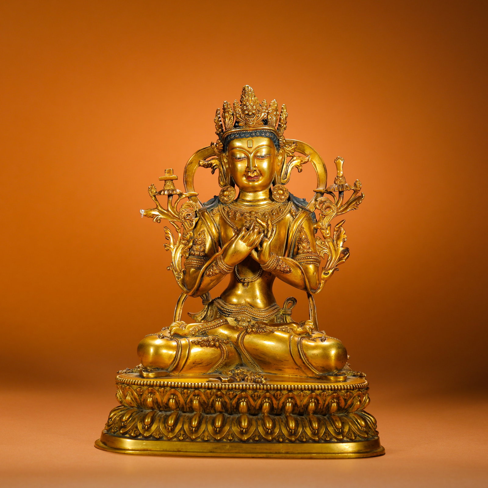 GILDED BRONZE STATUE OF MANJUSRI BODHISATTVA FROM THE QING DYNASTY: Height:25cm(9.84in) Width:19cm(7.48in) Weight:3560g(7.85lb)Qing Dynasty fully gilded bronze Manjushri Bodhisattva statue in Tibetan style, cast from fine brass with thick complete gilding. The Bodhisa