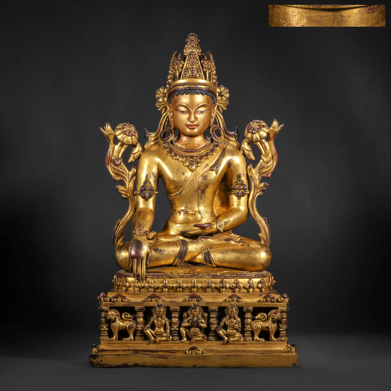 A GILDED BRONZE STATUE OF THE ENLIGHTENMENT OF SAKYAMUNI BUDDHA FROM THE QING DYNASTY: H:56.0cm(22.05in) W:34.0cm(13.39in) Weight:14600g(32.19lb)This statue is cast in bronze and gilded. Sakyamuni Buddha sits in the full-lotus posture on a double-layered lotus pedestal. He wears a