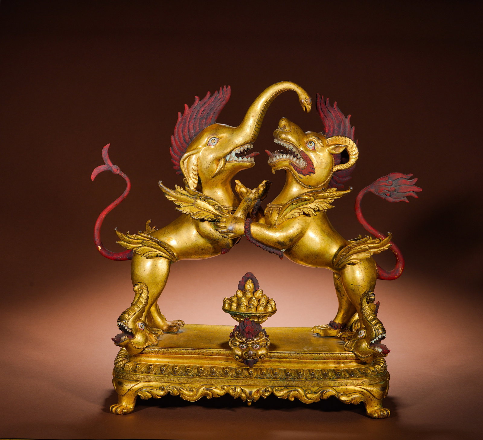 QING DYNASTY GILDED BRONZE ELEPHANT AND LION DOUBLE AUSPICIOUS GUARDIAN OFFERINGS