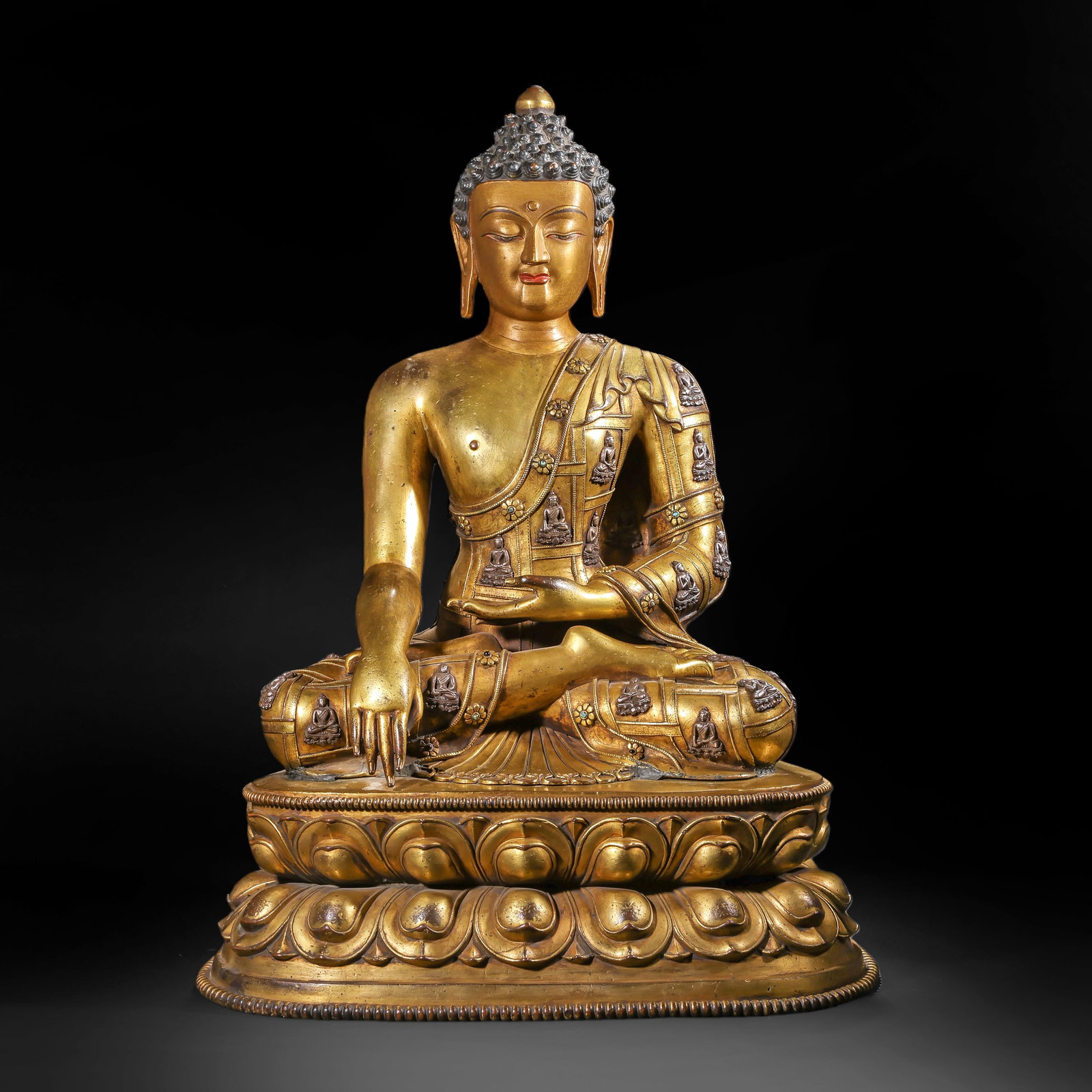 A GILDED BRONZE STATUE OF THE ENLIGHTENMENT OF SAKYAMUNI BUDDHA (A THOUSAND BUDDHA ROBE) FROM THE (1 of 17)