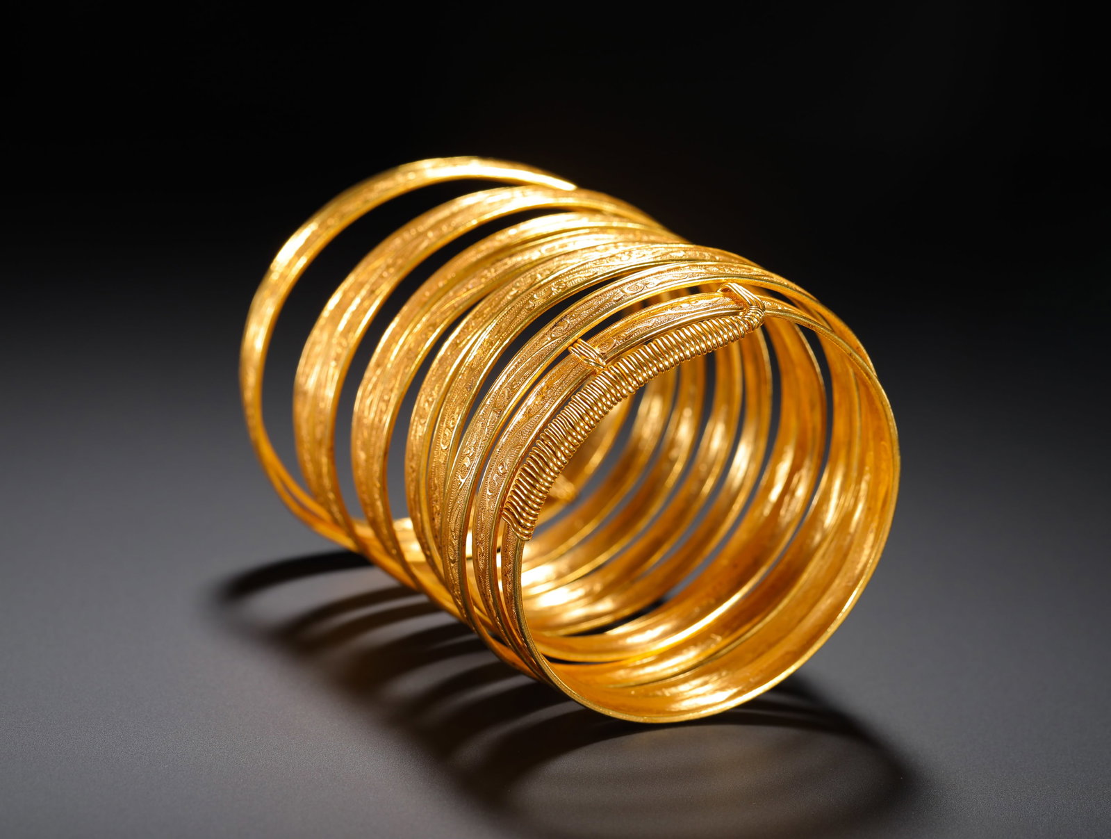 QING DYNASTY GILDED COPPER NINE-RING ENGRAVED BRACELET