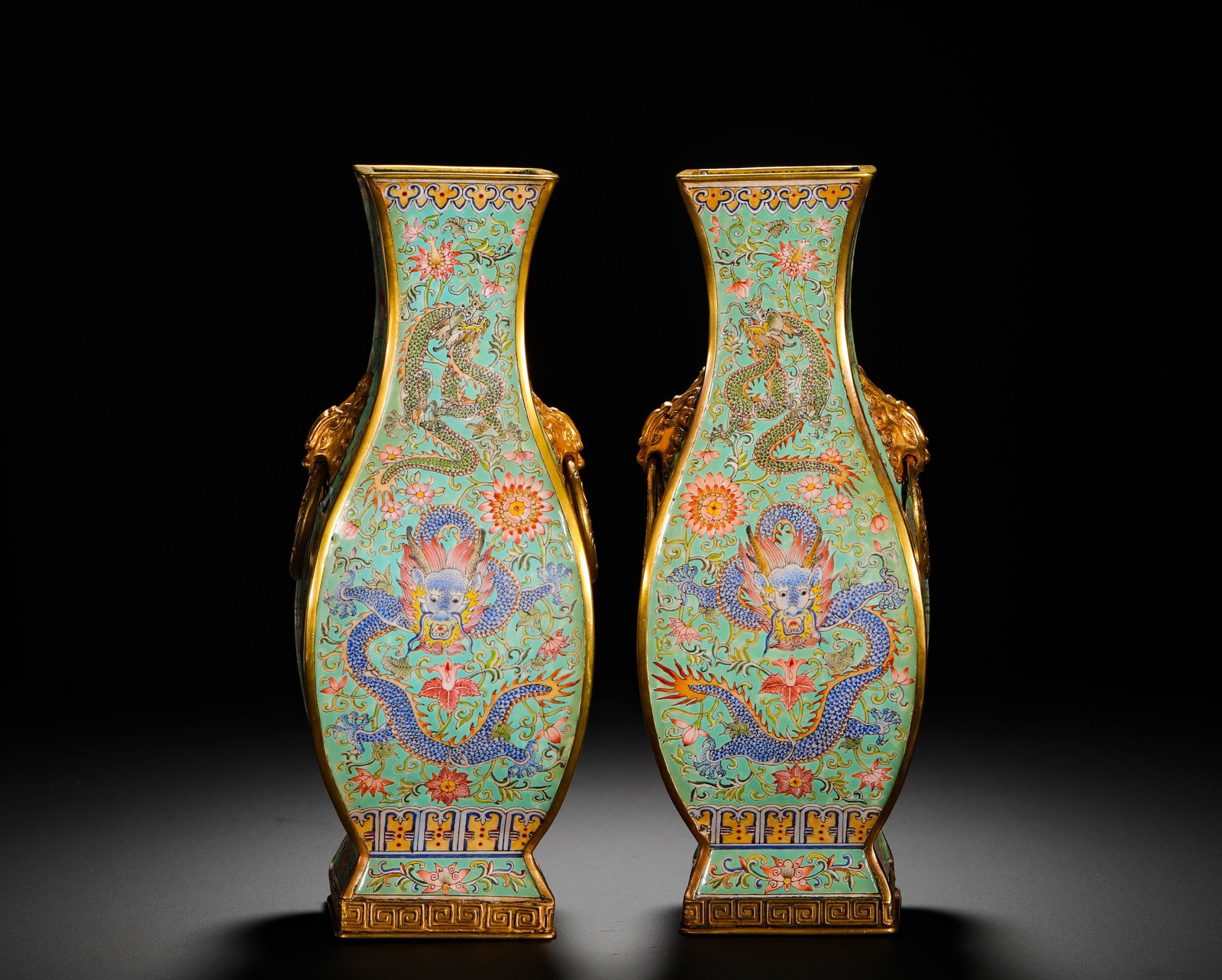 QING DYNASTY QIANLONG COPPERPLATE PAINTED GREEN SPACE ENAMEL FLAT VASE: Height:25cm(9.84in) Width:9.5cm(3.74in) Weight:1950g(4.30lb)Pair of Qing Qianlong square flattened bronze vases with twin dragon patterns on turquoise enamel ground. Fully gilded bronze body covered w