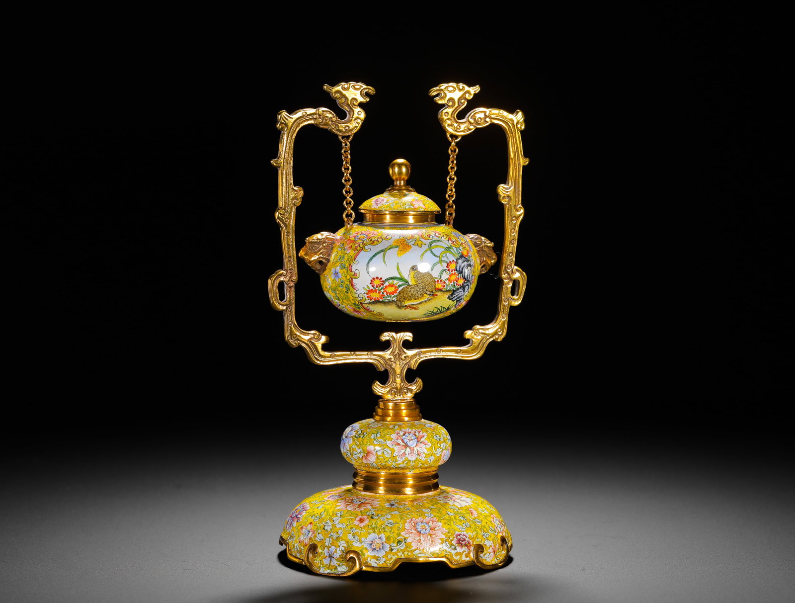 QING DYNASTY QIANLONG COPPER-PAINTED ENAMEL INCENSE BURNER: Height:21cm(8.27in) Width:12cm(4.72in) Weight:470g(1.04lb)Qing Qianlong painted enamel hanging incense burner with quail and chrysanthemum pattern symbolizing peaceful life. Three-piece set with gilde