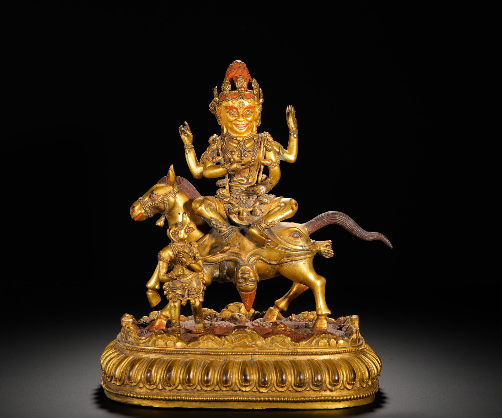 A GILDED BRONZE STATUE OF THE AUSPICIOUS MOTHER OF HEAVEN FROM THE QING DYNASTY: Height:25cm(9.84in) Width:22cm(8.27in) Weight:3960g(8.73lb)Fully gilded copper statue of Palden Lhamo, Qing Tibetan Buddhism. The Dharma Protector rides a yellow mule with fierce facial features,