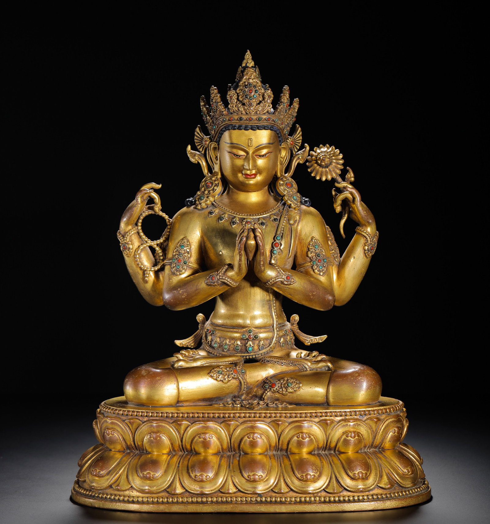 A SITTING STATUE OF THE FOUR-ARMED GUANYIN WITH GILDED BRONZE INLAYS FROM THE QING DYNASTY (1 of 9)