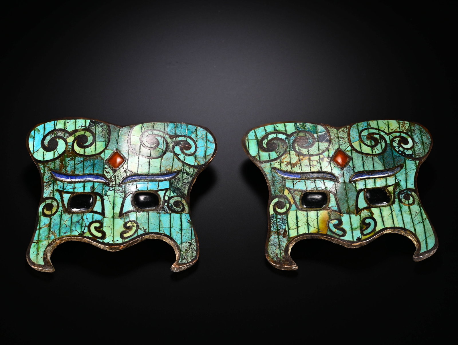 A PAIR OF BRONZE INLAID WITH TURQUOISE AND AGATE ANIMAL FACE ORNAMENTS FROM THE SHANG AND ZHOU (1 of 6)