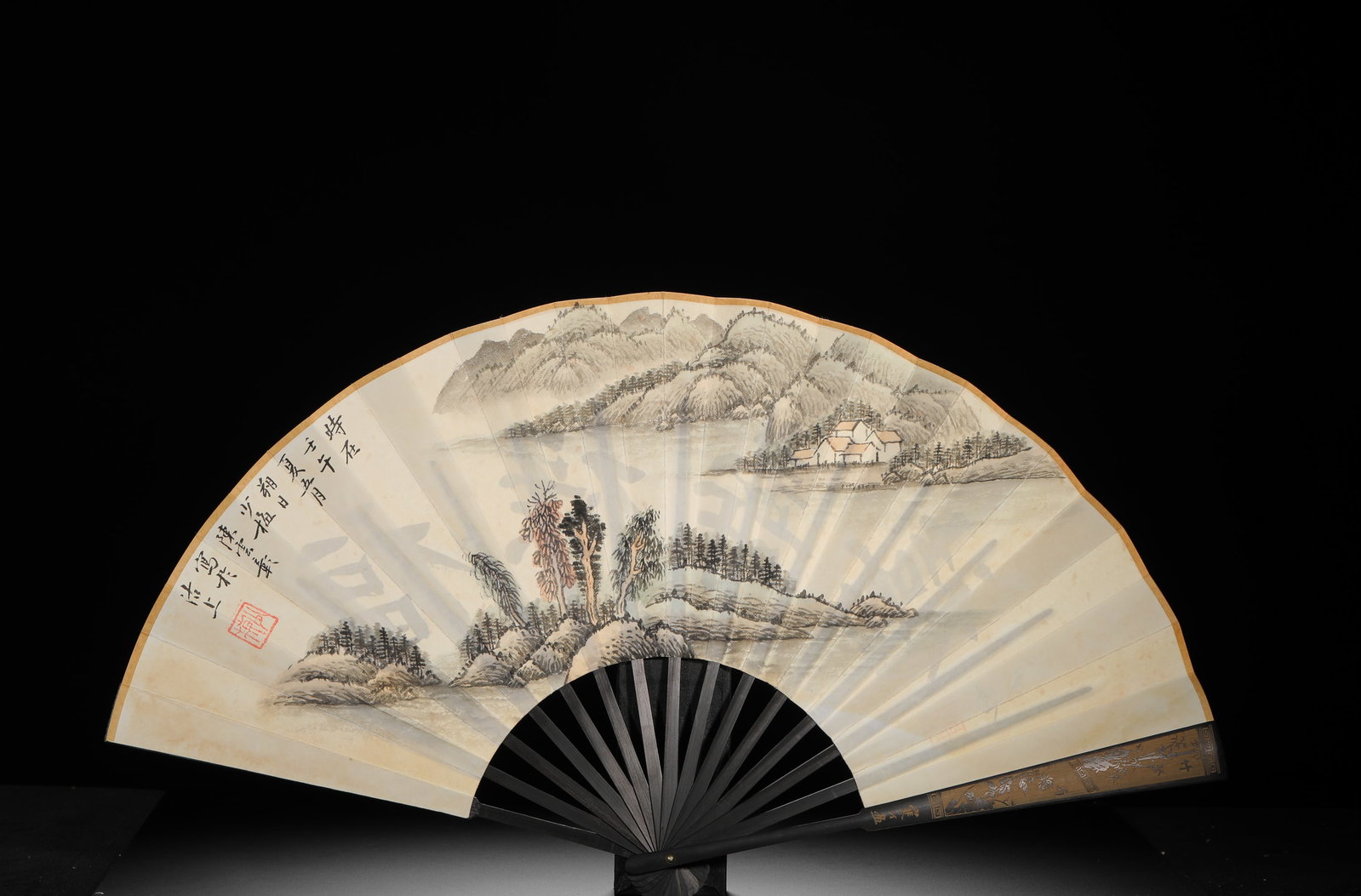 CHEN SHAOMEI'S LANDSCAPE PAINTING FAN: Height: 32cm(12.60in) Width: 60cm(23.62in) Weight: 90g(0.20lb)Folding fan with landscape and auspicious calligraphy painted by Chen Shaomei, master of modern Chinese painting. Carved black wood ribs, 