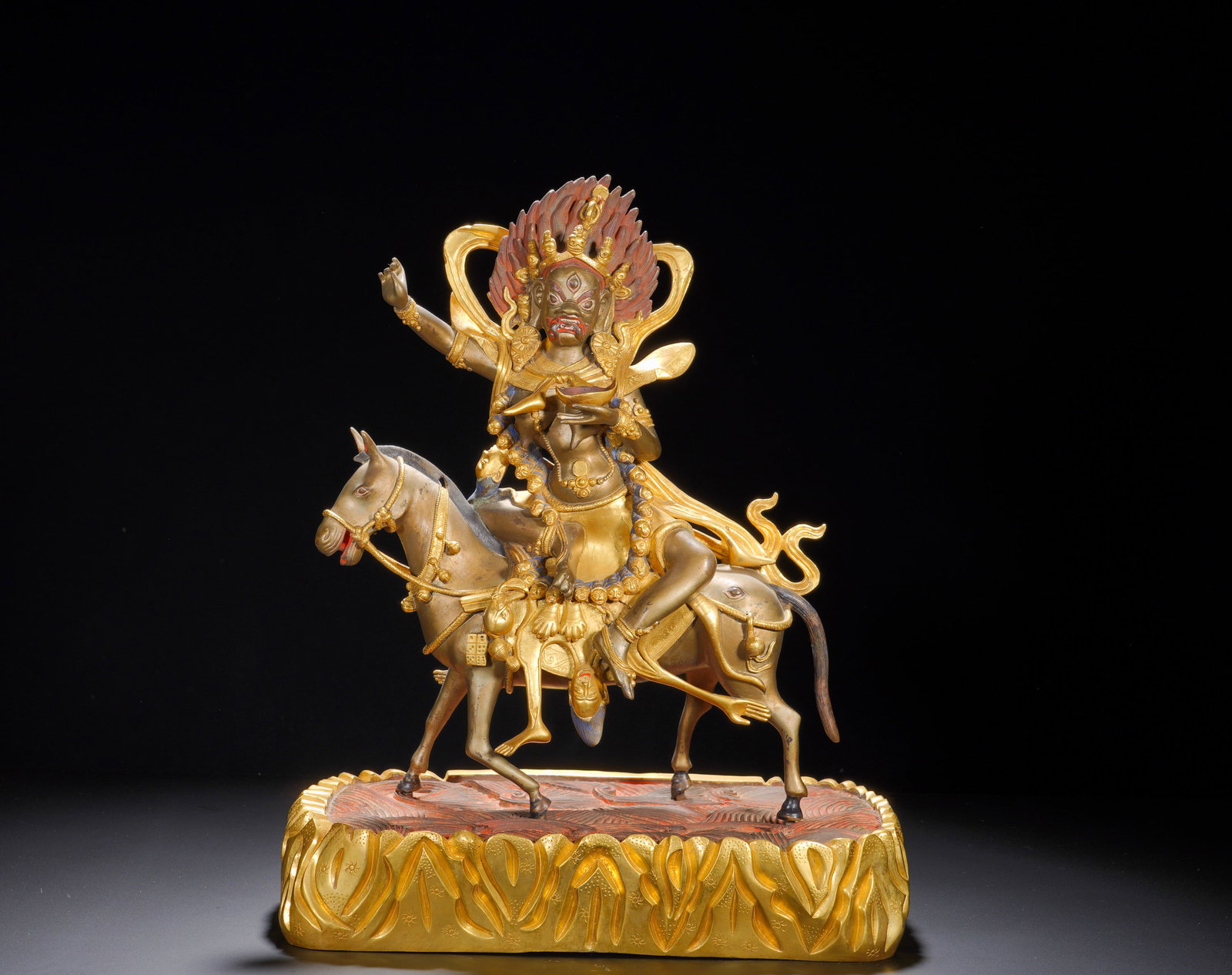 A GILDED BRONZE STATUE OF THE AUSPICIOUS MOTHER RIDING A MULE FROM THE MING DYNASTY: Height: 47cm(18.50in), Width: 37cm(14.57in), Weight: 14690g (32.386lb)Partially Gilt Bronze Statue of Palden LhamoThis partially gilt bronze figure depicts Palden Lhamo, the principal Dharma protector